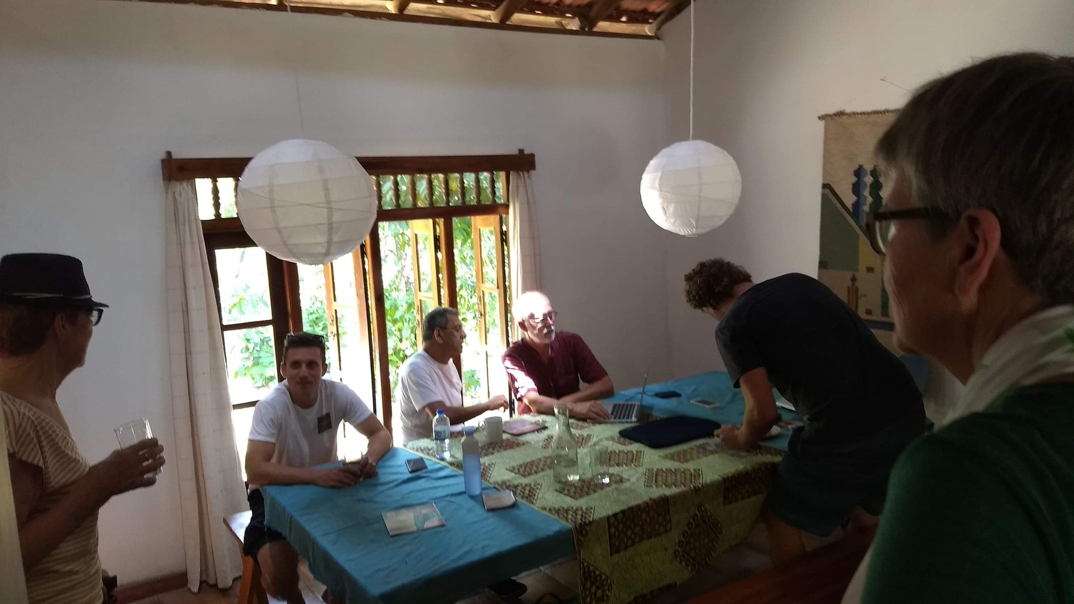 Guests sharing a meal around the dining table