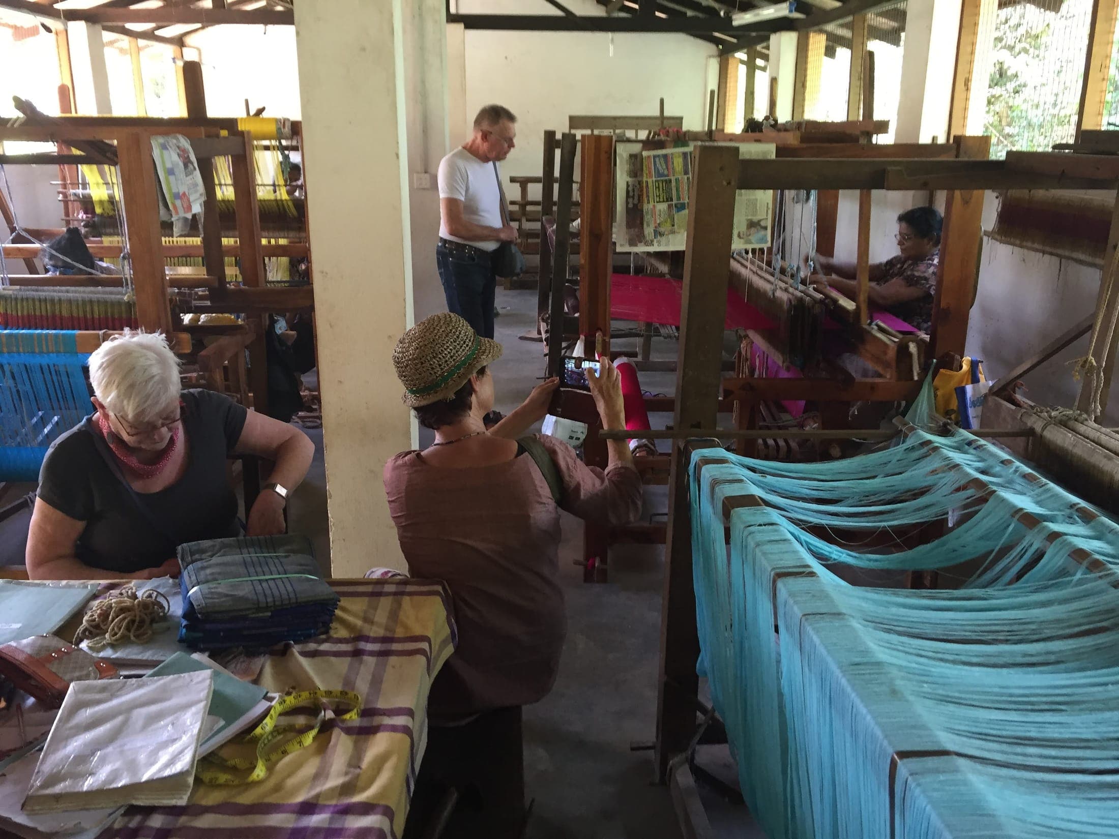 Visitors at the local handloom weaving mill